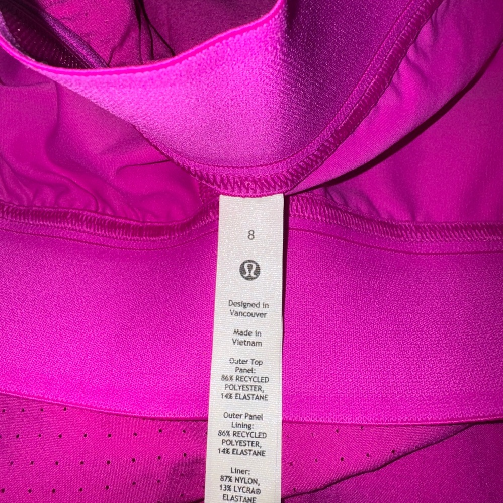 Brand new Lululemon skort, original tags attached, magenta color.